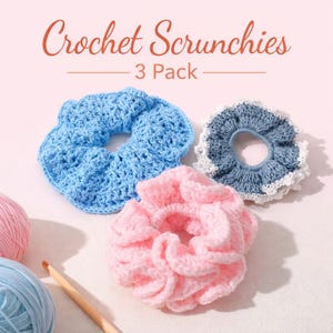 May include: Three crochet scrunchies in light blue, pink, and blue with white trim. The text "Crochet Scrunchies - 3 Pack" is at the top. A crochet hook and yarn are in the lower left corner. The scrunchies are handmade.