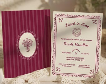 May include: A bridal shower invitation set featuring a deep magenta card with vertical stripes and a central floral oval, alongside a cream-colored card with a scalloped border, heart graphic, and text reading Laced in Love for Nicole Hamilton.