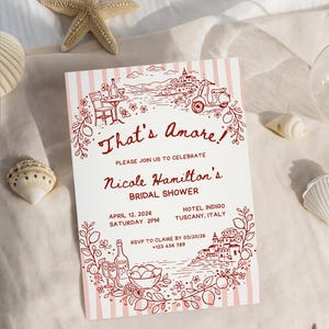 May include: A bridal shower invitation with a Tuscan theme. The invitation features a red and white striped background with illustrations of Italian scenery, a scooter, and the text "That's Amore!" and event details.