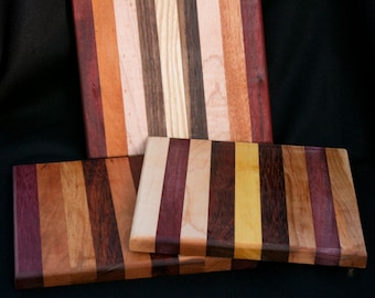 wood cutting board/butcher block made of many domestic  and exotic woods. 18 x 8.5".  i will pick one out and send it to you