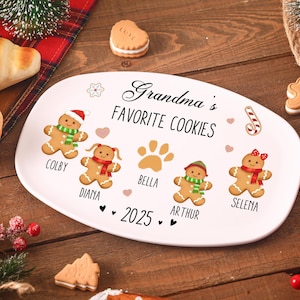 May include: White oval ceramic serving platter with the text "Grandma's Favorite Cookies". The platter features gingerbread people illustrations with names, paw prints, hearts, and a candy cane design. The year 2025 is also printed on the platter.