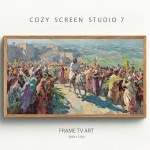 May include: A framed print depicting a religious scene with a central figure on a donkey, amidst a crowd carrying palm branches. The artwork uses warm colours and is labelled "COZY SCREEN STUDIO 7" and "FRAME TV ART".