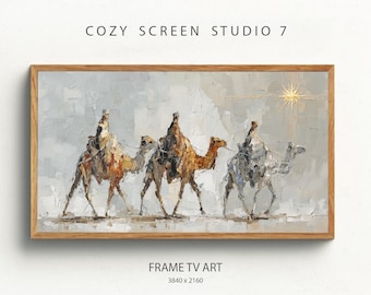 Op de afbeelding: Een olieverfschilderij met drie kamelen met ruiters, tegen een neutrale achtergrond. Het kunstwerk is ingelijst in een houten lijst en heeft een ster in de rechterbovenhoek. De tekst "COZY SCREEN STUDIO 7" en "FRAME TV ART" zijn zichtbaar.