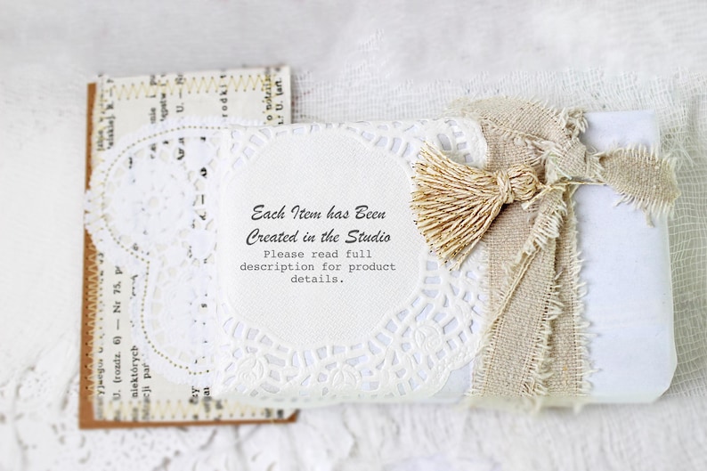 May include: A white gift box wrapped in burlap and lace with a small, beige tassel. The box has a white label with the text "Each Item has Been Created in the Studio. Please read full description for product details."