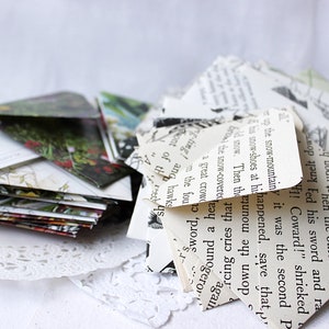 May include: A stack of folded paper envelopes made from recycled book pages. The envelopes are decorated with text and illustrations. The text on the envelopes reads: "g which Shce sprang to the nearest be uodn 15hen the other bira Fed his sword and ra 1! Coward!" shrieked up the snow-mountainy it was the second P his snow-shoes at hihappened, save that p d snow. Then the uno now the snow-covered a great crowd hea down the rcing cries tha again y e punogero PJO g-ting! ang hawks sont of th 245 the fou 'proms"
