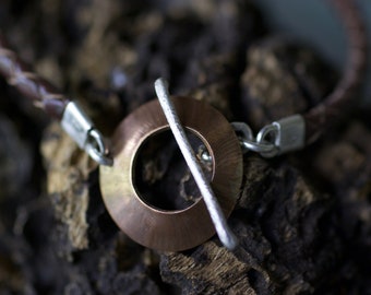 Braided leather, silver and bronze bracelet