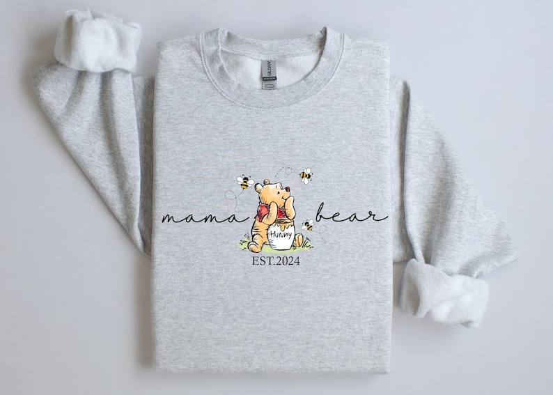 a gray shirt with a picture of a teddy bear on it