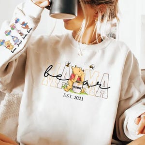 a woman sitting on a couch holding a coffee mug