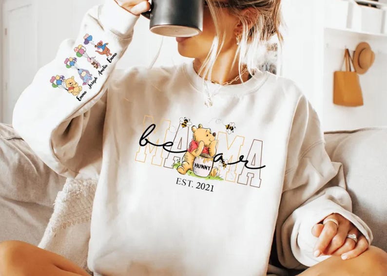 a woman sitting on a couch holding a coffee mug