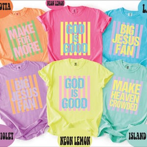 May include: Six short-sleeved crew neck t-shirts in various colors including terracotta, neon lemon, lagoon, neon violet, and island reef. Each shirt features a rectangular graphic with vertical stripes and text reading Make For More, God Is Good, Big Jesus Fan, or Make Heaven Crowded.