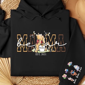 a black hoodie with a picture of a teddy bear on it