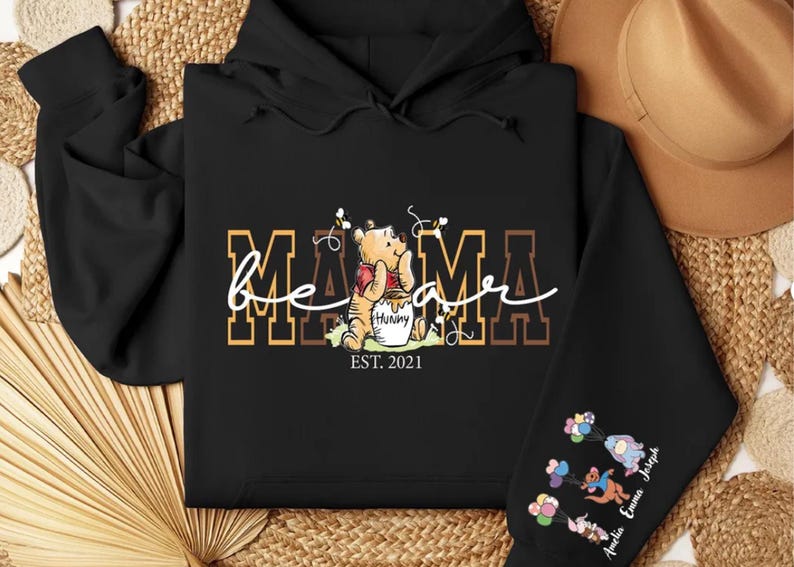 a black hoodie with a picture of a teddy bear on it