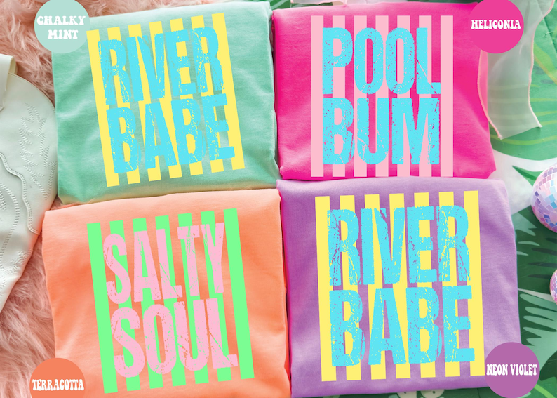 four colorful t-shirts with text printed on them, arranged in a square formation.