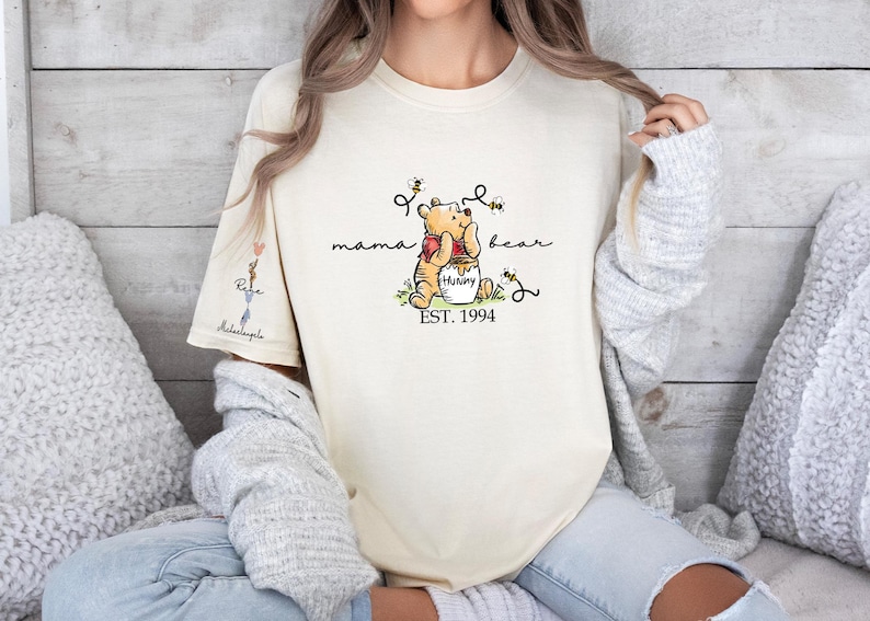 a woman wearing a winnie the pooh t - shirt