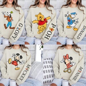 The image is a collage of five images featuring people wearing sweatshirts with Disney character designs.