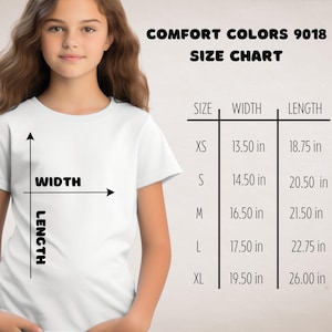 a young girl wearing a white t-shirt with a size chart and measurements for different shirt sizes.