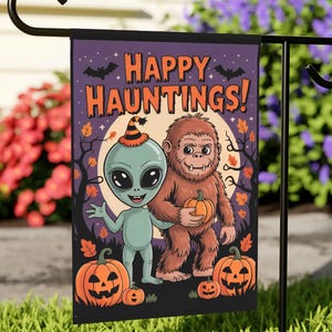 May include: A Halloween garden flag with an alien and a Bigfoot character holding pumpkins, and the text "HAPPY HAUNTINGS!" on a purple background. The design includes bats, trees, and jack-o'-lanterns, ideal for Halloween.