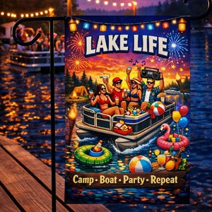May include: A decorative garden flag with the words "LAKE LIFE" and a colorful illustration of a lake party scene. The image shows people on a boat, fireworks, and the text "Camp • Boat • Party • Repeat".