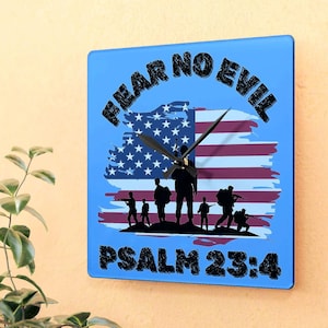 May include: Blue square clock with a distressed American flag background and the text "Fear No Evil Psalm 23:4". Silhouettes of soldiers are standing in front of the flag.