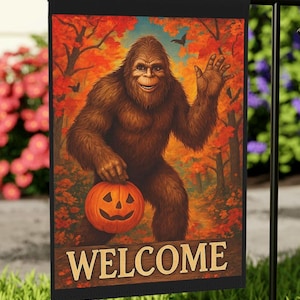 May include: A Halloween garden flag featuring a smiling Bigfoot holding a jack-o'-lantern. The flag has a black border and the word "WELCOME" at the bottom. The background shows an autumn forest scene.
