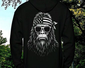 Bigfoot USA Flag Hoodie: Patriotic Sasquatch Hiking Camping Adventure Sweatshirt