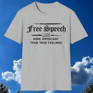 May include: A grey t-shirt with the text "Free Speech" in a black gothic font. Below the text is a small American flag and the text "More Important Than Your Feelings".