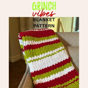 May include: A chunky knit blanket featuring horizontal stripes in lime green, bright red, and white. The text GRINCH vibes BLANKET PATTERN is displayed above the blanket. The yarn has a thick, soft texture with visible loops throughout the design.