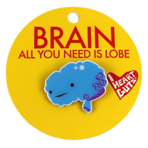 May include: A yellow circle with the text "BRAIN ALL YOU NEED IS LOBE" in red. A blue brain with a purple swirl design and a smiling face is attached to the circle. The text "I HEART GUTS" is on a red heart shape in the bottom right corner.