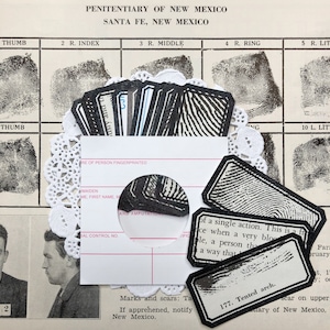 May include: A black and white image of a fingerprint card with the text "PENITENTIARY OF NEW MEXICO SANTA FE, NEW MEXICO" at the top. The card has spaces for fingerprints and information about the person being fingerprinted. The text "Marks and scars: Ta If apprehended, notify New Mexico." is at the bottom of the card.