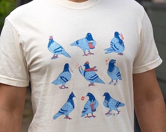 Camiseta gráfica de Palomas Divertidas de Nueva York: Diseño peculiar en colores cómodos