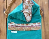 Smitha. Large fold over crossbody messenger with front pocket. Adjustable strap and size.