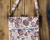 Helene. Large fold over crossbody bag with front pocket. Adjustable strap and size.