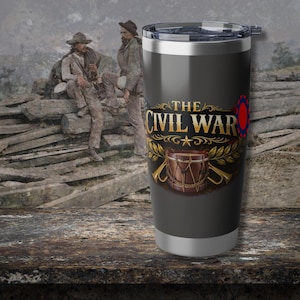 May include: A stainless steel travel mug with a black background and the words "The Civil War" in gold lettering. The mug features a drum and bugles graphic. The background shows a sepia-toned image of two men in Civil War era clothing.