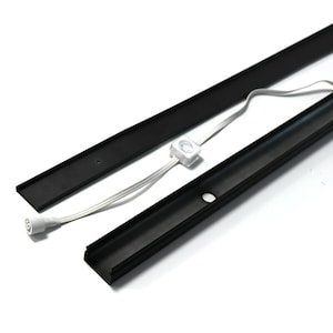 May include: Two black aluminium track light profiles with a white LED light connector. The track profiles are designed to hold LED light strips.
