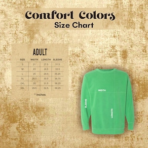May include: A green adult-sized sweatshirt with a size chart. The chart displays measurements in inches for width, length, and sleeve length, ranging from size small to 3XL. The text "Comfort Colors" and "Size Chart" are at the top.