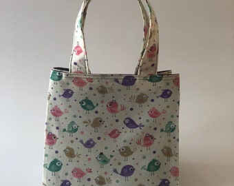 Small Lunch Tote Bag in a beige, Purple, teal, pink and tan bird print fabric with purple lining