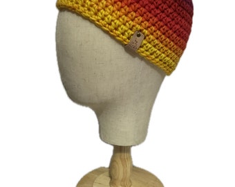 Children’s Sunset beanie in yellow, orange, pink, red and purple variegated yarn