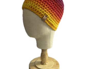 Regular sized Sunset beanie in yellow, orange, pink, red and purple variegated yarn