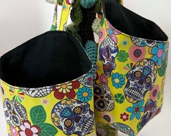 Pair of Small Hanging Storage Baskets in a yellow based multi coloured skull print fabric