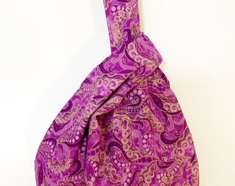 Small Japanese Knot Bag in a purple and gold paisley print