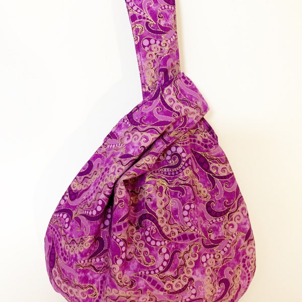 Small Japanese Knot Bag in a purple and gold paisley print