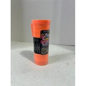 May include: A bright orange cylindrical plastic container with a black label featuring the text PJ CALL PRO. The label includes a graphic of a blue and white bird, circular imagery, and small printed text. The container has a side clip attachment.