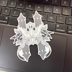 May include: A black and white sticker with a stylized design of two towers with a sword and wings in the center. The towers have a keyhole design.