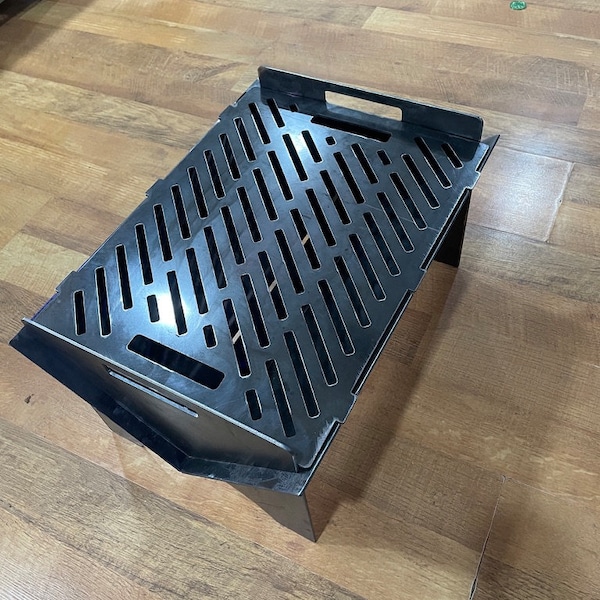 Collapsible fire pit with cooking grate