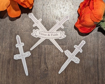 May include: Three white stickers with sword designs and text. The top sticker features two swords crossed with the text "Virtue & Faith". The left sticker features a single sword with the text "Light Breaker". The right sticker features a single sword with the text "Fate's Guardian".