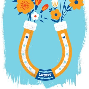 May include: A yellow horseshoe with a blue and white stripe and the word "LUCKY" on it.  A bouquet of flowers in shades of orange, red, white, and blue are inside the horseshoe.