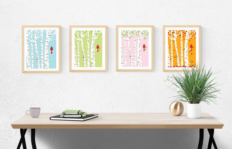 May include: Four framed prints depicting birch trees with a red cardinal bird on each. The prints are in different colours: blue, green, pink, and orange.