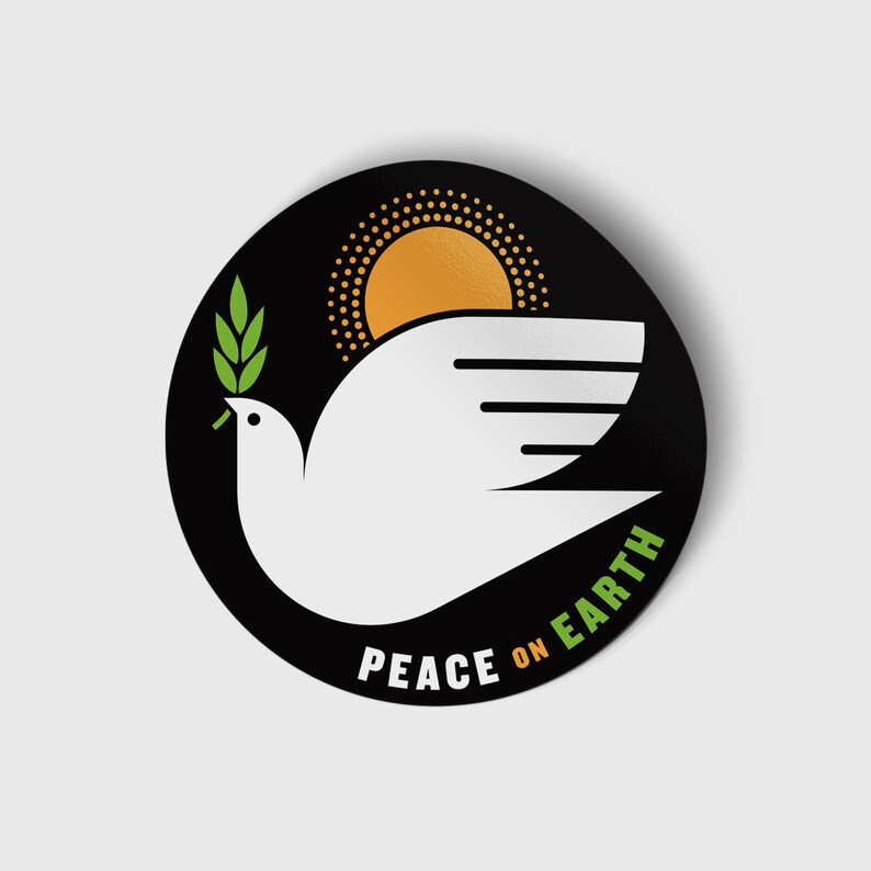 May include: A black and white sticker with a white dove carrying a green olive branch, flying in front of a yellow sun with a black dotted outline. The text "Peace on Earth" is written in a green and orange arc below the dove.