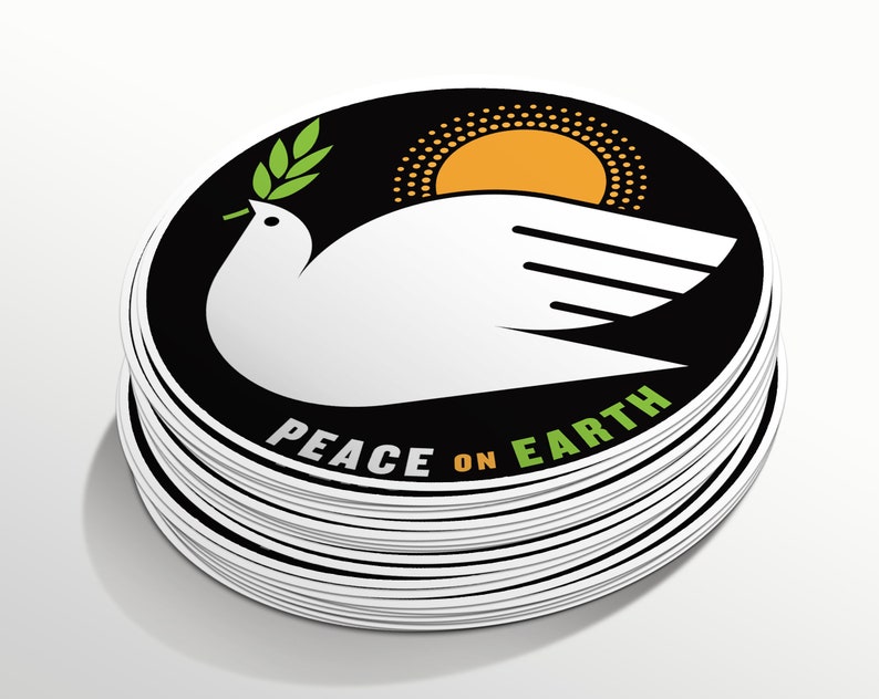 May include: A stack of round stickers with a black background, a white dove with an olive branch in its beak, a yellow sun, and the text "Peace on Earth".