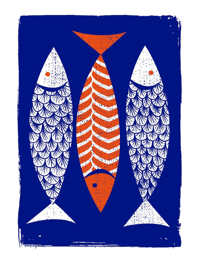 May include: A stylized print featuring three fish against a dark blue background. The central fish is orange with a patterned design, flanked by two white fish with blue scale details. The artwork has a textured, hand-printed aesthetic.